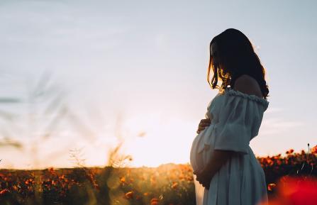 Pregnant woman in a field