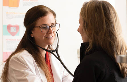 Cardiologist Kerrilynn Hennessey, MD, with a patient.