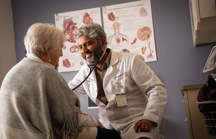 Kalyan Ghanta, MD, with a patient at Dartmouth Hitchcock Clinics Manchester
