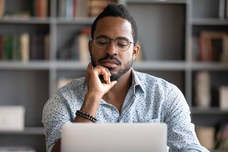 Man looking at an online course