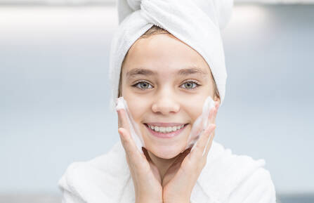 Girl washing her face