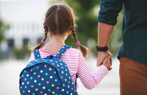 Girl going to school with a backpack