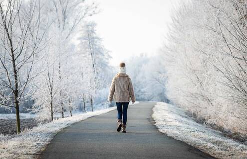 Woman walking in snow