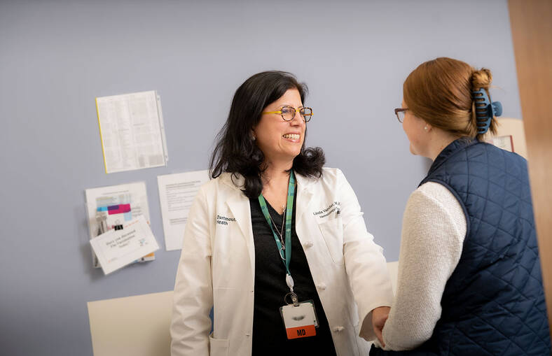 Linda T. Vahdat, MD, MBA, with a patient in the Breast Cancer Clinic at DHMC