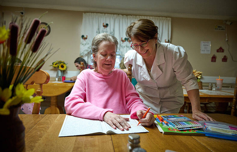 Susan Januszewski working with a patient