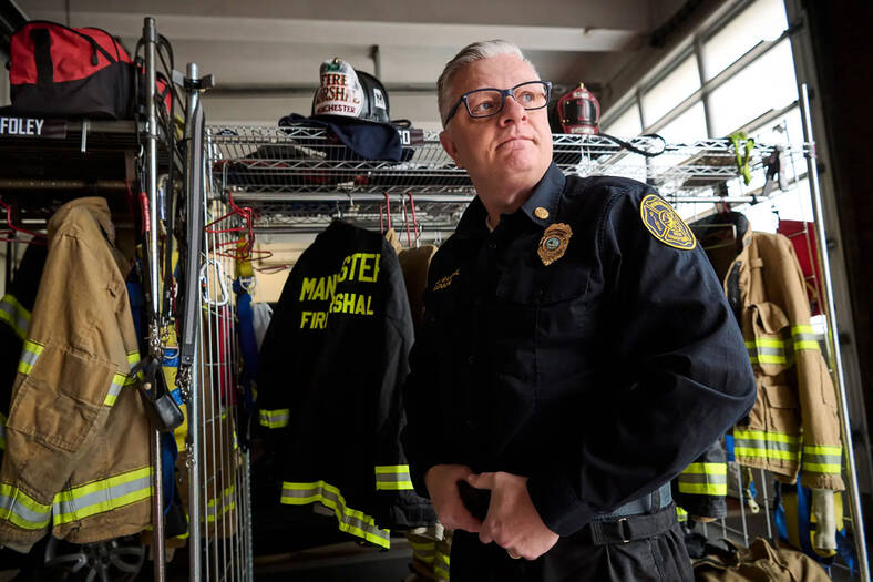 Firefighter Peter Lennon in uniform at the station